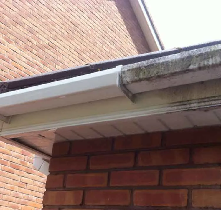 Heavily stained soffits and fascias before cleaning - soffit and fascia cleaning in Altrincham