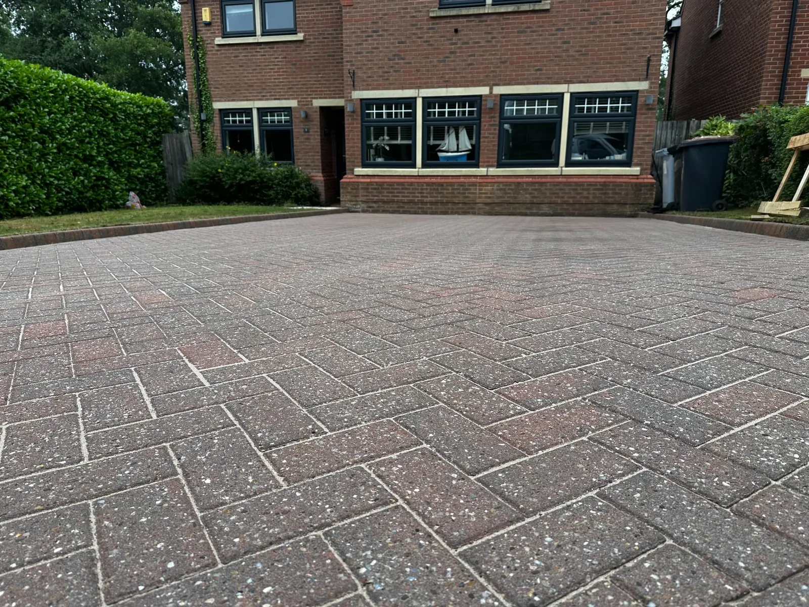 Low-angle view of professionally cleaned and re-sanded block paving driveway near Runcorn