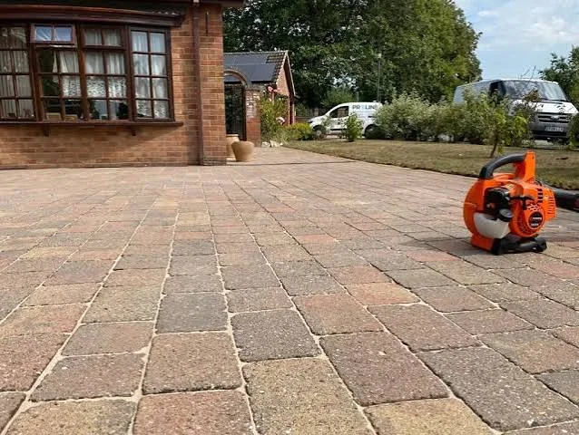 Professional driveway surface cleaning in progress by Proline Exterior Cleaning