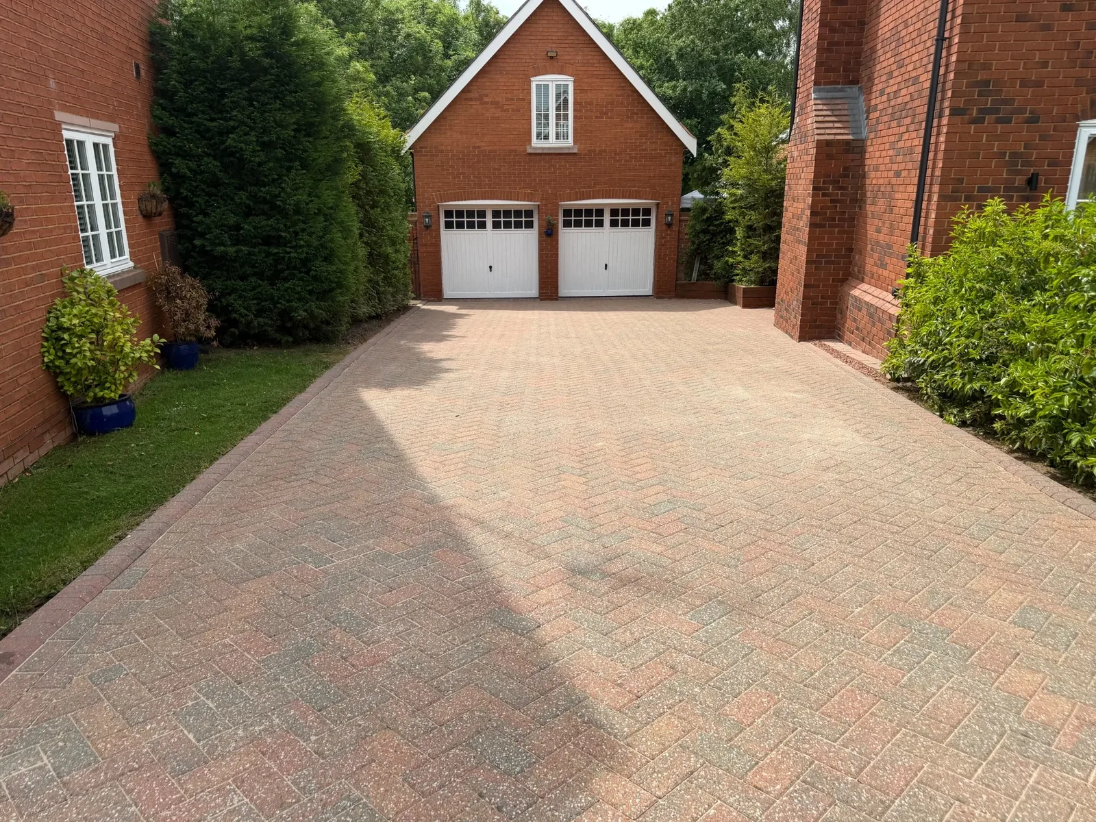 Common driveway staining, moss and surface contamination before professional cleaning in Kidsgrove