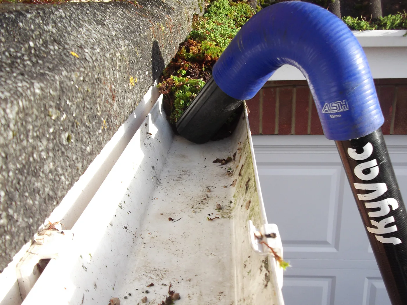 Gutter vacuum cleaning an accessible residential gutter channel in Holmes Chapel