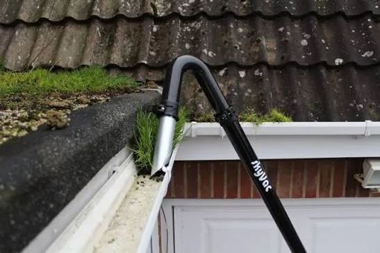 High-reach vacuum pole positioned at a residential gutter in Holmes Chapel