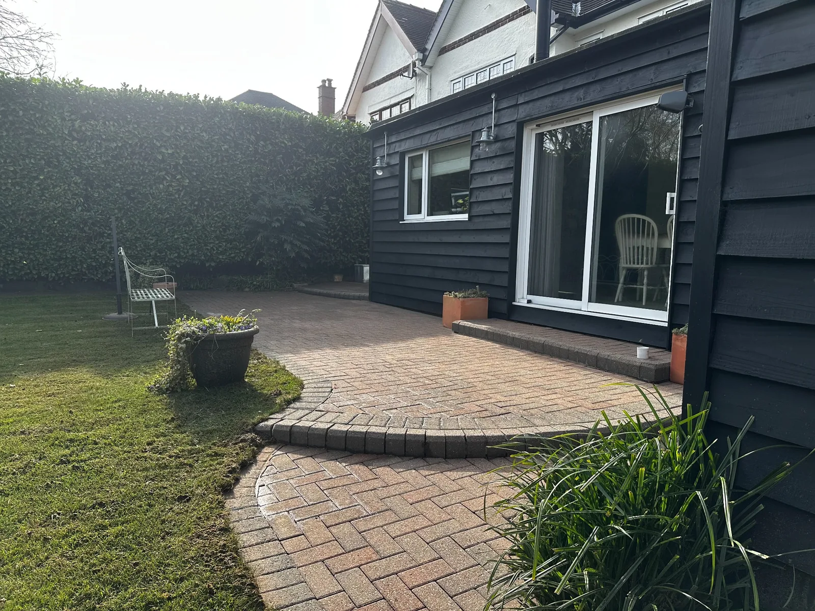 Restored block-paved patio and garden walkway after professional cleaning