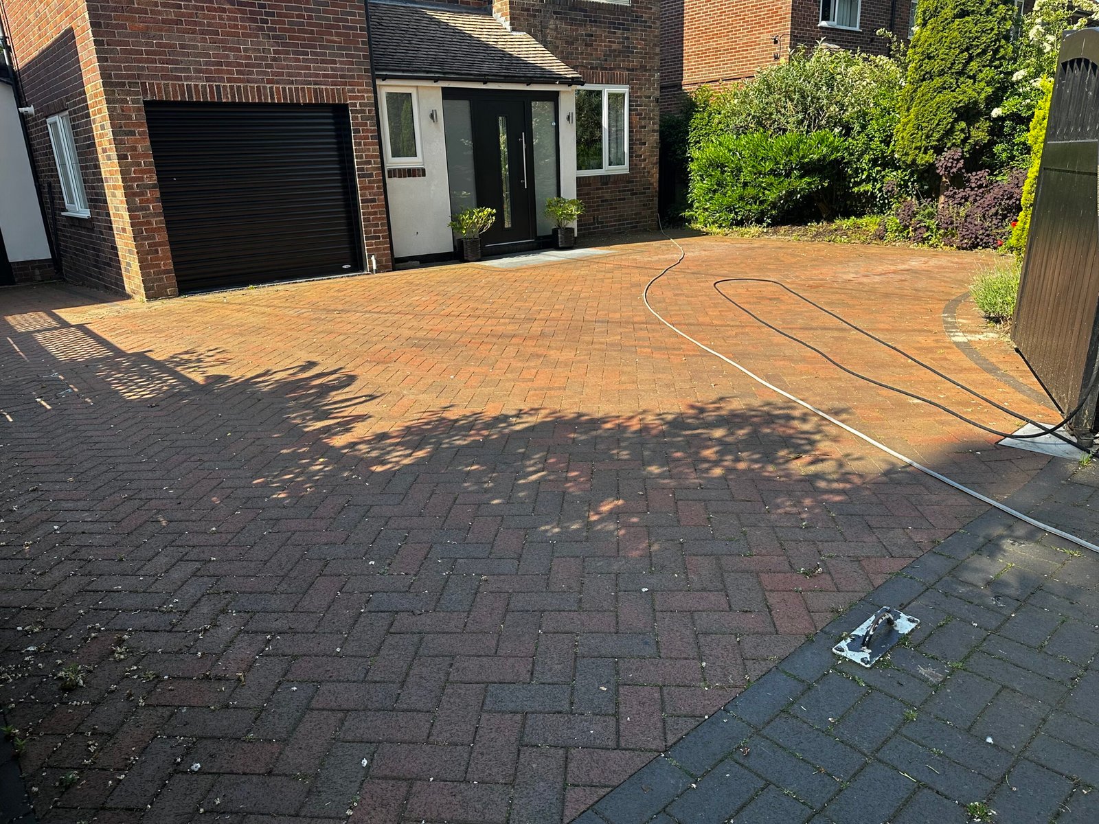 Block paving driveway before professional cleaning by Proline Exterior Cleaning